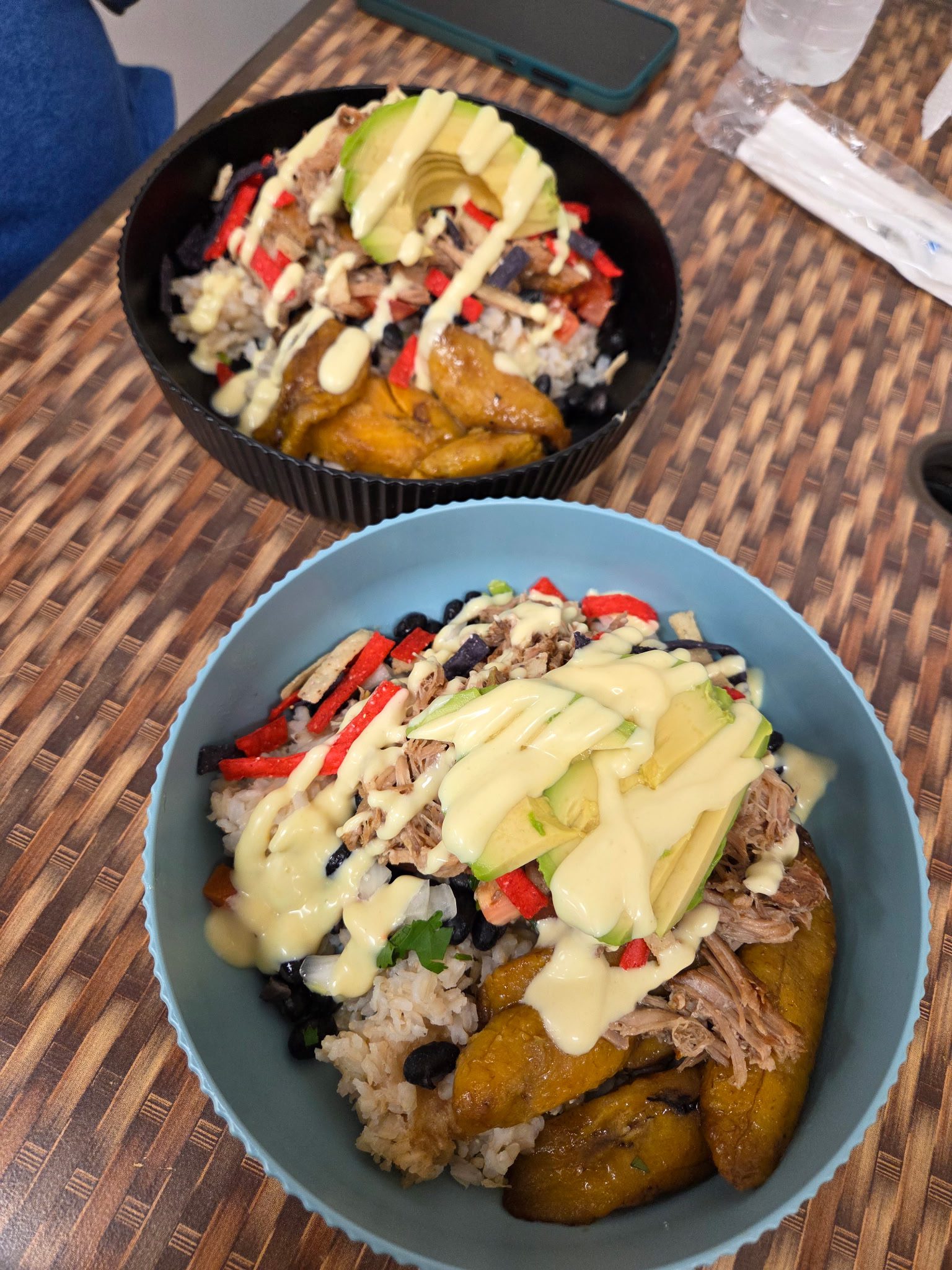 Handwritten chalkboard menu at So Flo featuring rice bowls and Caribbean wraps.